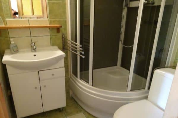 In room bathroom with shower